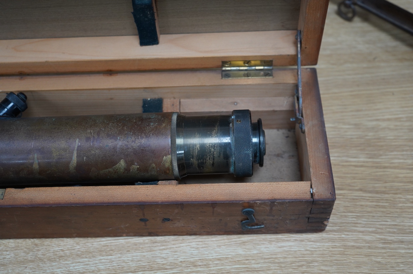 A First World War telescope gunsight by W. Watson & Sons Ltd., London, stamped S.S. Telescope x8 3348, and dated 1918, in its original pine case, sight 52cm long, case 68.5cm long. Condition - fair.